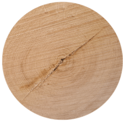 A circular piece of wood with a hole in it.